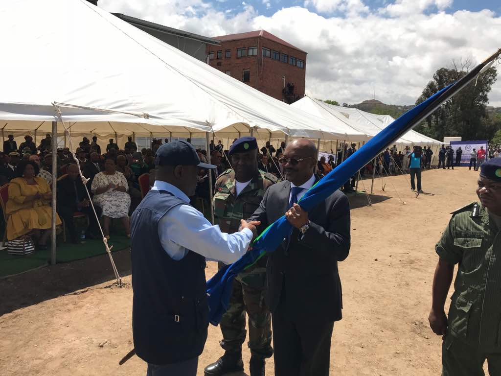 Admiral Rufino handing over the SADC flag to the Head of mission